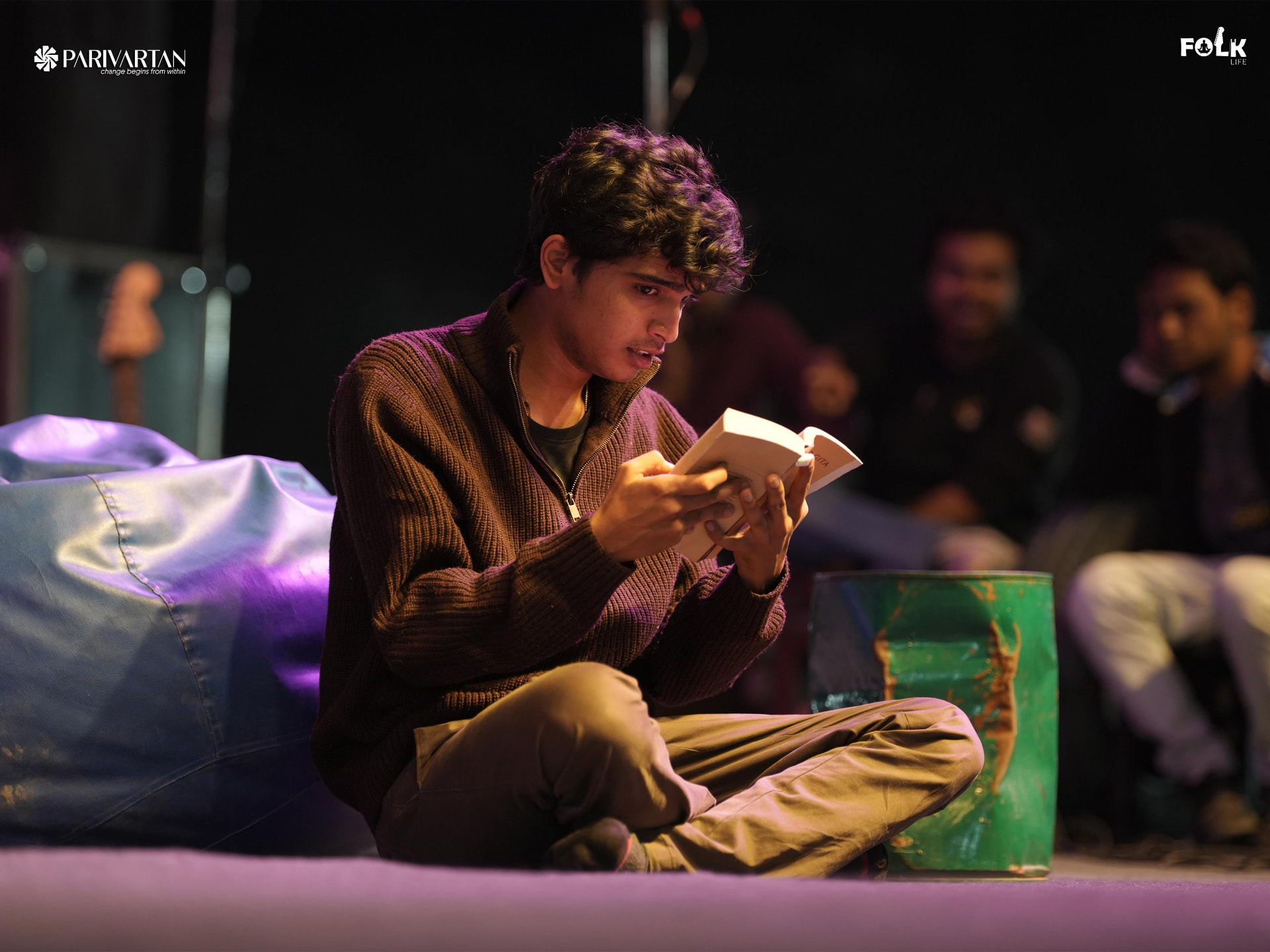 A performer reading during Road to Parivartan at Hare Krishna Mandir, Bhadaj