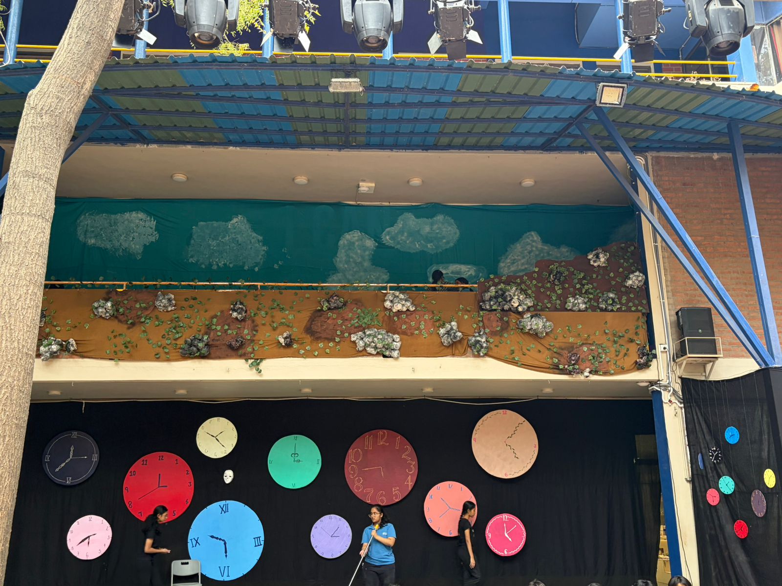Hand-painted clock set pieces created during the Artist in Residence programme at The Riverside School